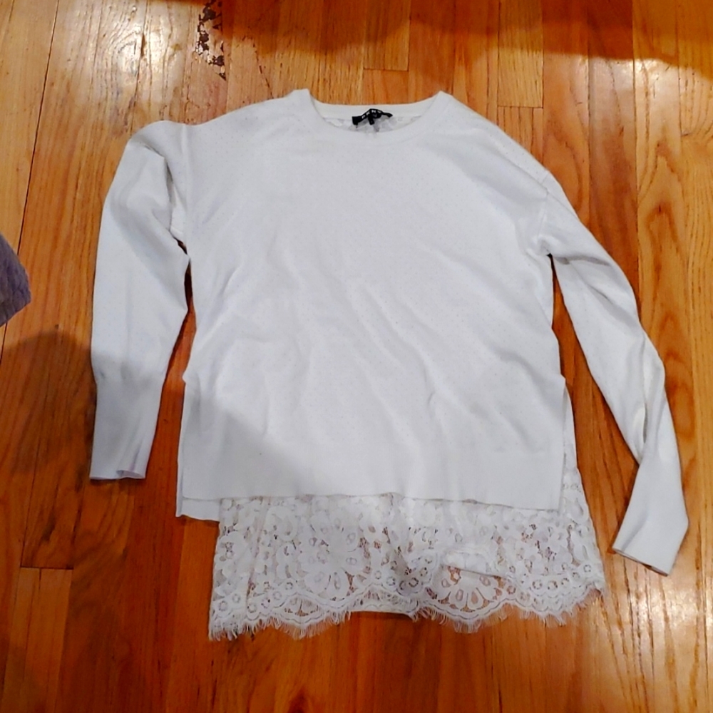 Cream sweater from Donna Karan New York that has a Lacey under bottom